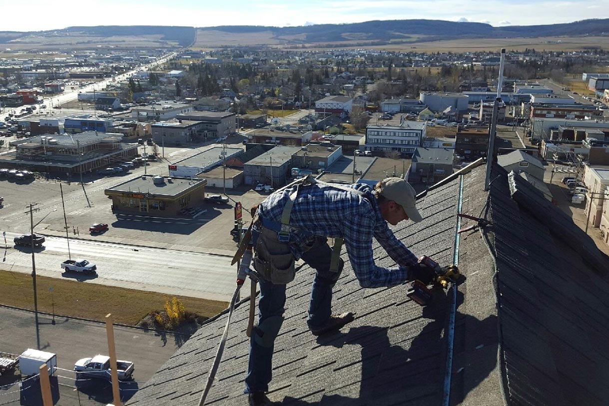 Roofing the Dawson Creek art gallery with asphalt shingles
